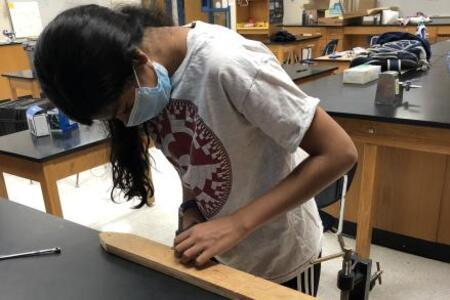 Anaya cutting a screw for the launcher.