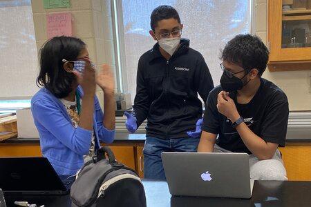 Anish, Ashish & Mili talking about code.